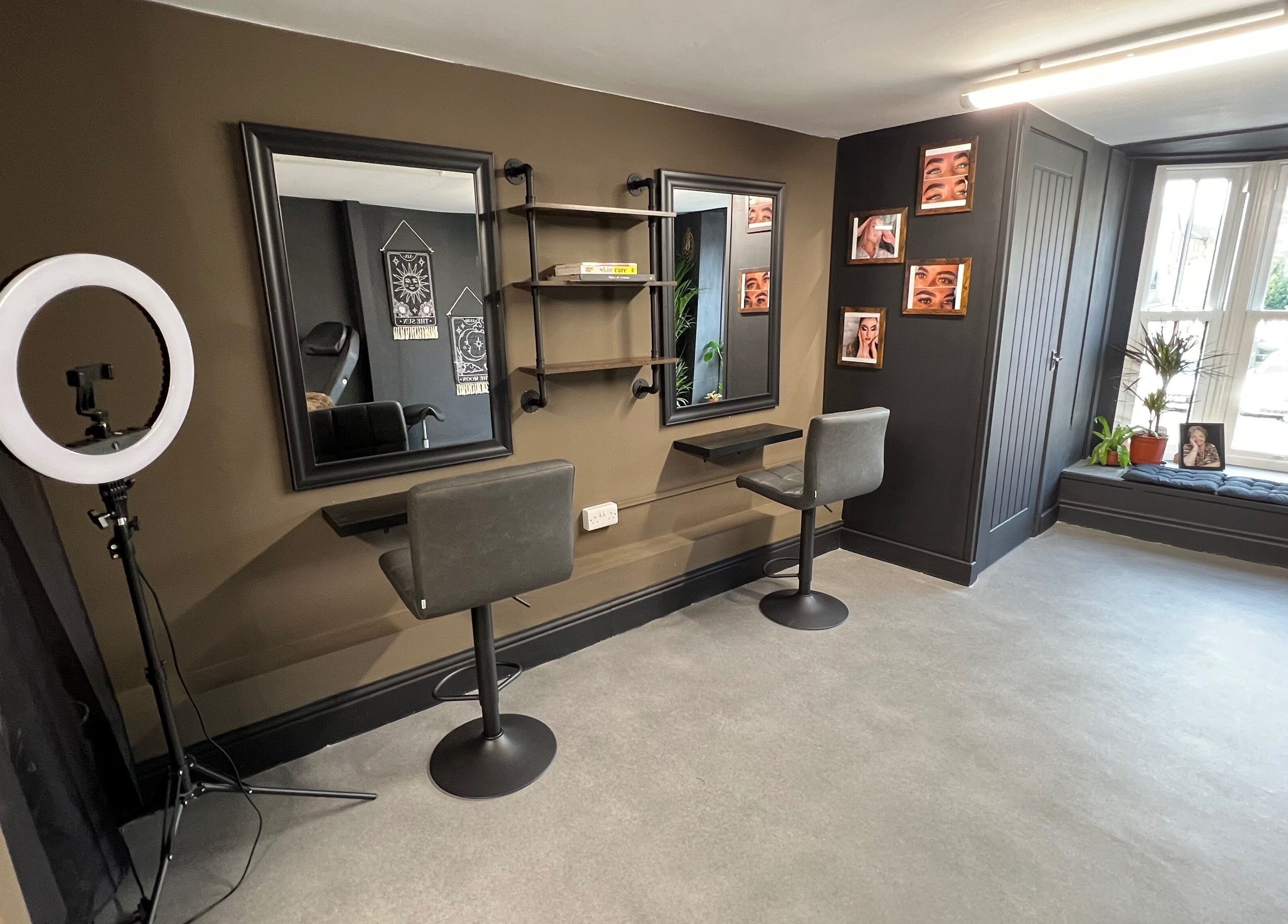 Stylish interior of Tiny Face / Steph, Guisborough, England, GB with two salon chairs and mirrors.