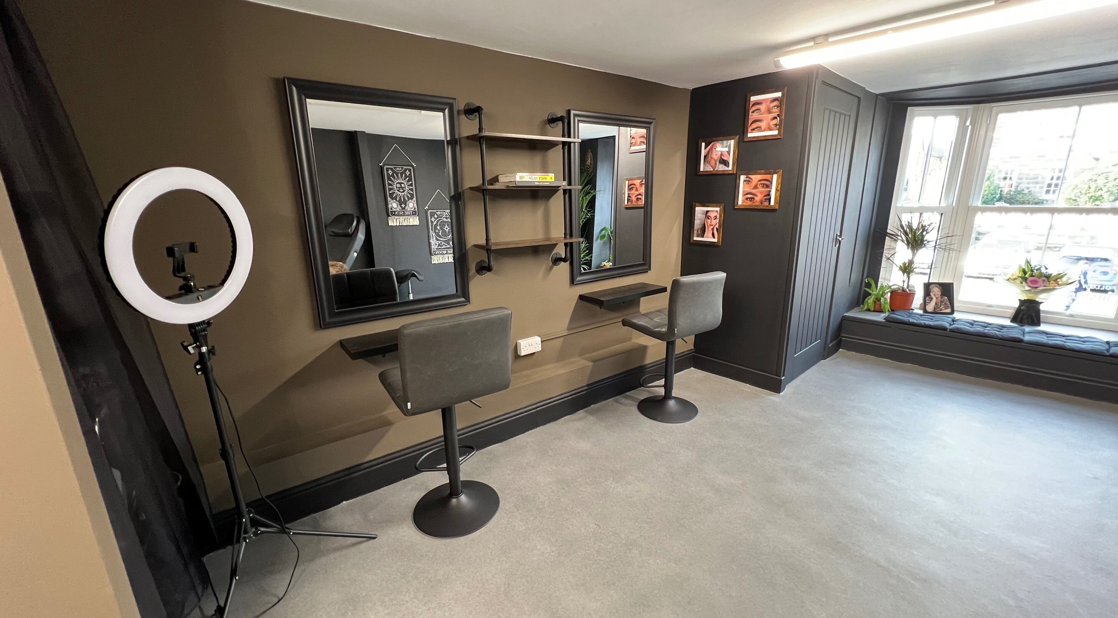 Stylish interior of Tiny Face / Steph, Guisborough, England, GB with two salon chairs and mirrors.