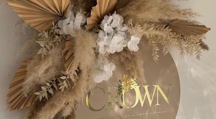 Elegant golden sign with natural decor at Beauty by Chloe, Dundee, Scotland, GB.