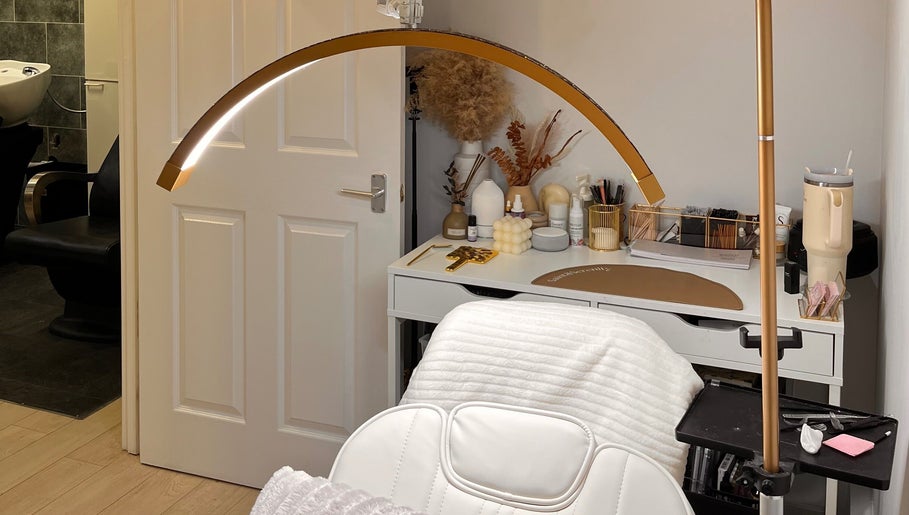 Beauty By Martyna's tranquil spa room with plush chair and modern decor in Stirling, Scotland, GB.