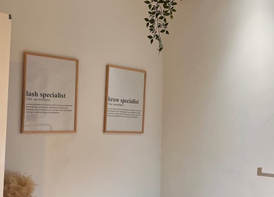 Beauty By Martyna, Stirling features framed lash and brow specialist signs on a light wall.