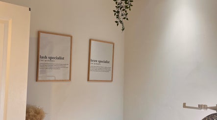 Beauty By Martyna, Stirling features framed lash and brow specialist signs on a light wall.
