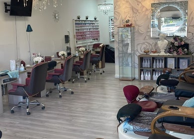 Luxurious interior of True Bella Nails Spa in Hacienda Heights, California, US, featuring manicure stations and plush chairs.