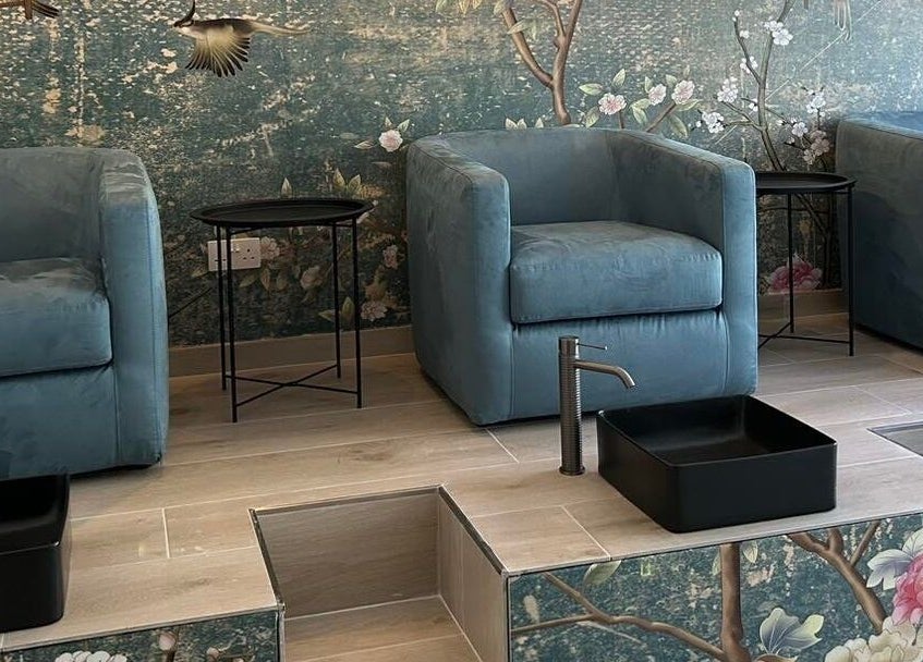 Luxurious seating area at Xuefei Salon, Birkirkara, MT, with floral decor and modern amenities.