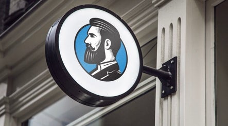 Round sign at Adam's Republic | Al-Shati, الدمام, المنطقة الشرقية, SA with vintage barber illustration.