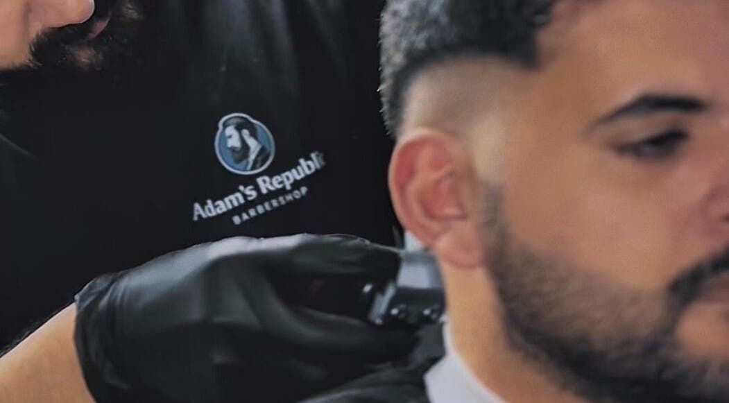 Barber at Adam's Republic | Al-Shati in Dammam, المنطقة الشرقية, SA skillfully trims a client's hair.