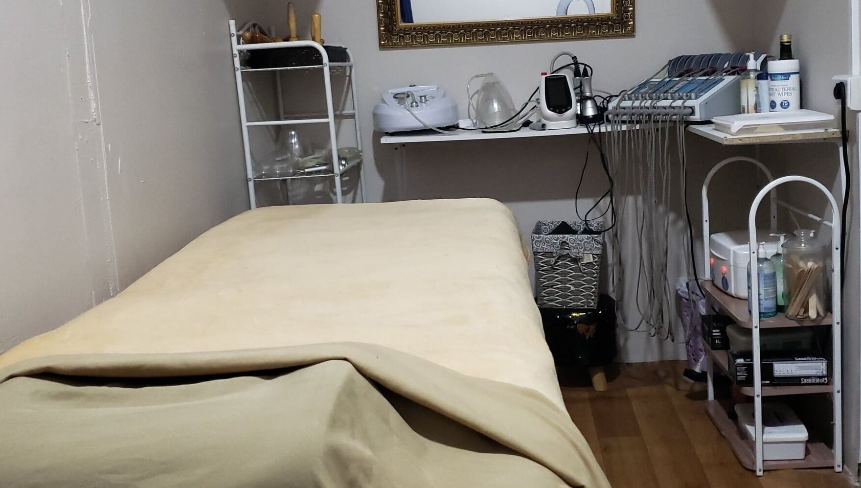 Relaxing treatment room at InnoSense Salon and Med Spa in St. James, TT, featuring a comfortable bed.