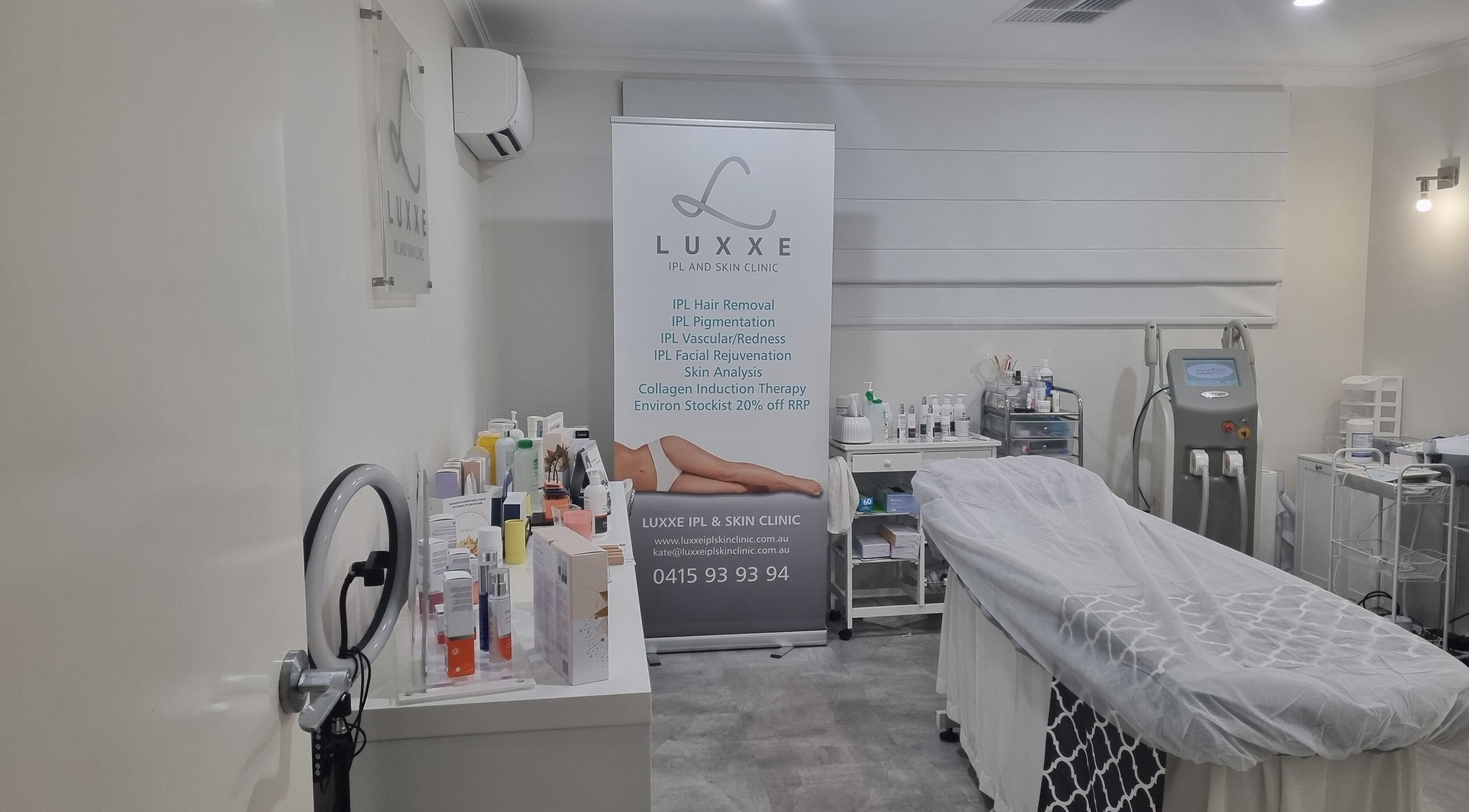 Modern treatment room at Luxxe IPL and Skin Clinic, Burns Beach, featuring skincare products and equipment.