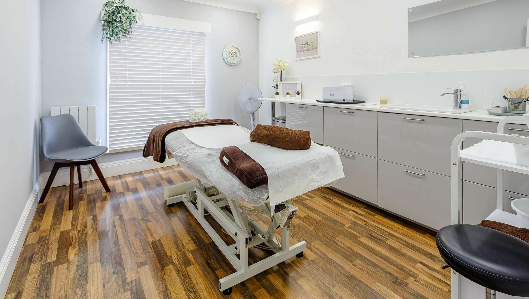 Tranquil massage room at Harmony Day Spa Royston, Royston, England, GB, featuring a cozy treatment bed.