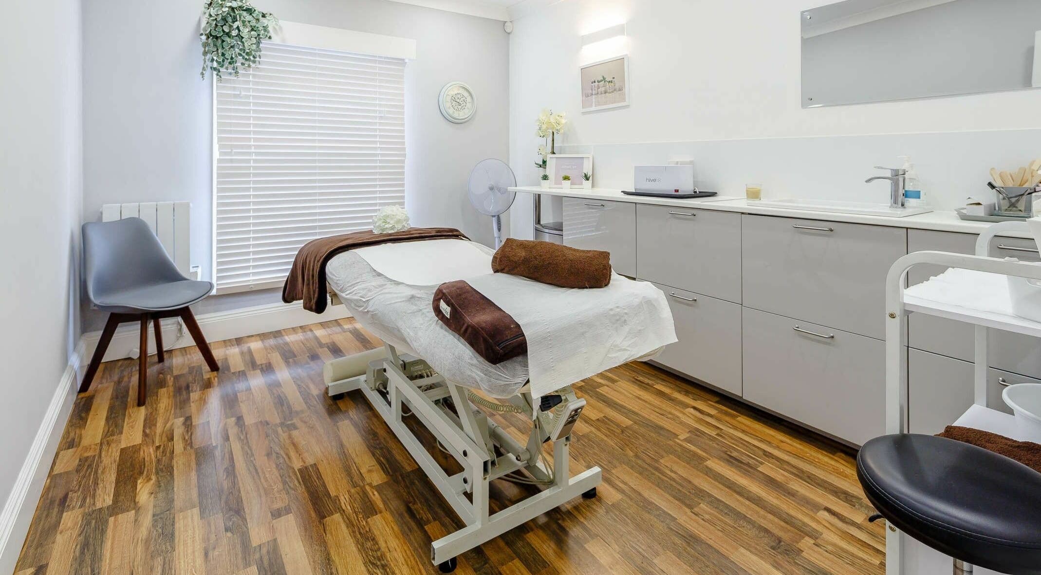 Tranquil massage room at Harmony Day Spa Royston, Royston, England, GB, featuring a cozy treatment bed.