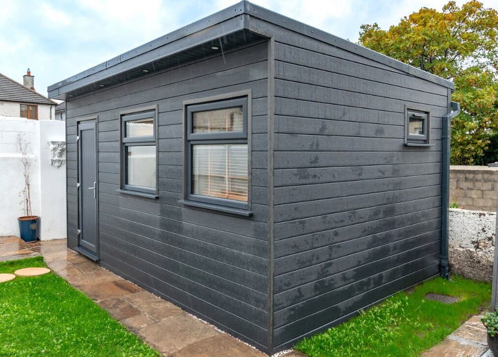 Modern wellness shed at Relaxing Therapies, Dublin 8, County Dublin, IE, surrounded by lush greenery.