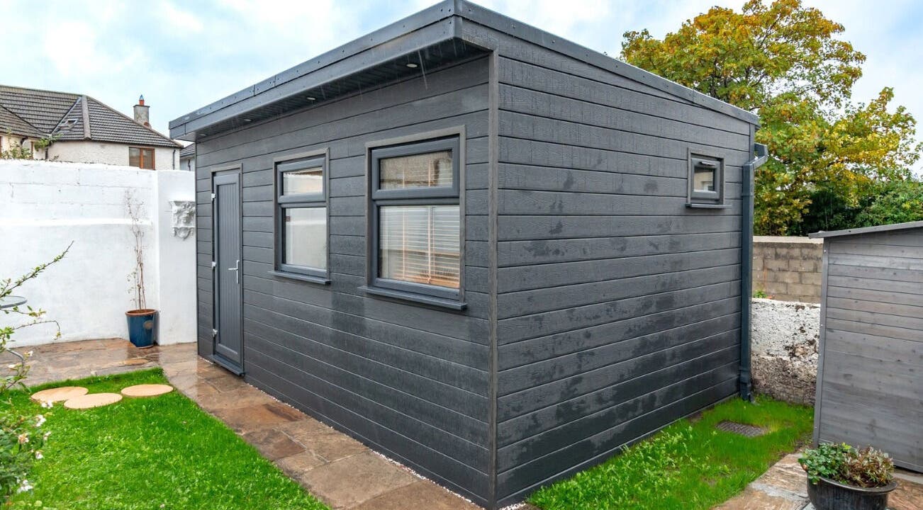 Modern wellness shed at Relaxing Therapies, Dublin 8, County Dublin, IE, surrounded by lush greenery.
