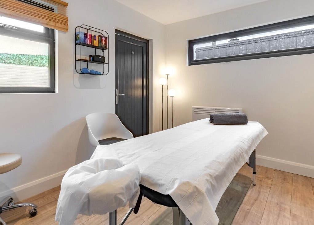 A tranquil therapy room at Relaxing Therapies in Dublin 8, County Dublin, IE, featuring a massage table.