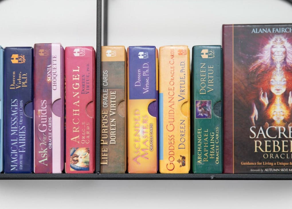 Oracle cards on a shelf at Relaxing Therapies, Dublin 8, County Dublin, IE, offer spiritual guidance.