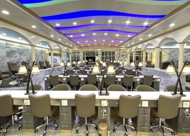 Luxurious interior of Luminous V Nail Spa in Springboro, Ohio, US, featuring modern nail stations and ambient lighting.