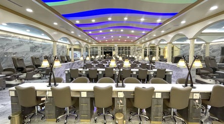 Luxurious interior of Luminous V Nail Spa in Springboro, Ohio, US, featuring modern nail stations and ambient lighting.