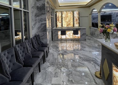 Luxurious interior of Luminous V Nail Spa in Springboro, Ohio, US with elegant seating and marble decor.