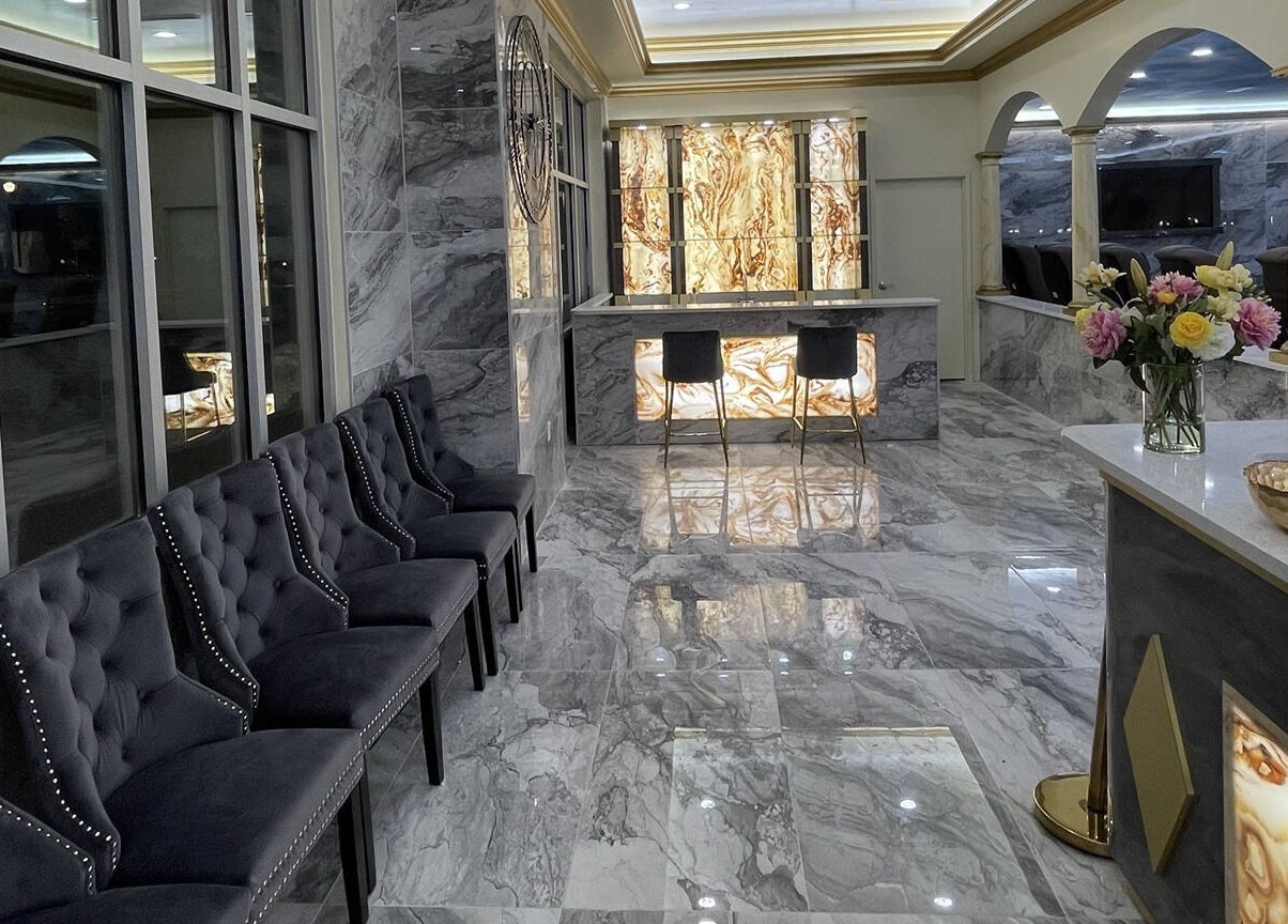 Luxurious interior of Luminous V Nail Spa in Springboro, Ohio, US with elegant seating and marble decor.