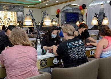 Clients receiving nail treatments at Luminous V Nail Spa, Springboro, Ohio, US.