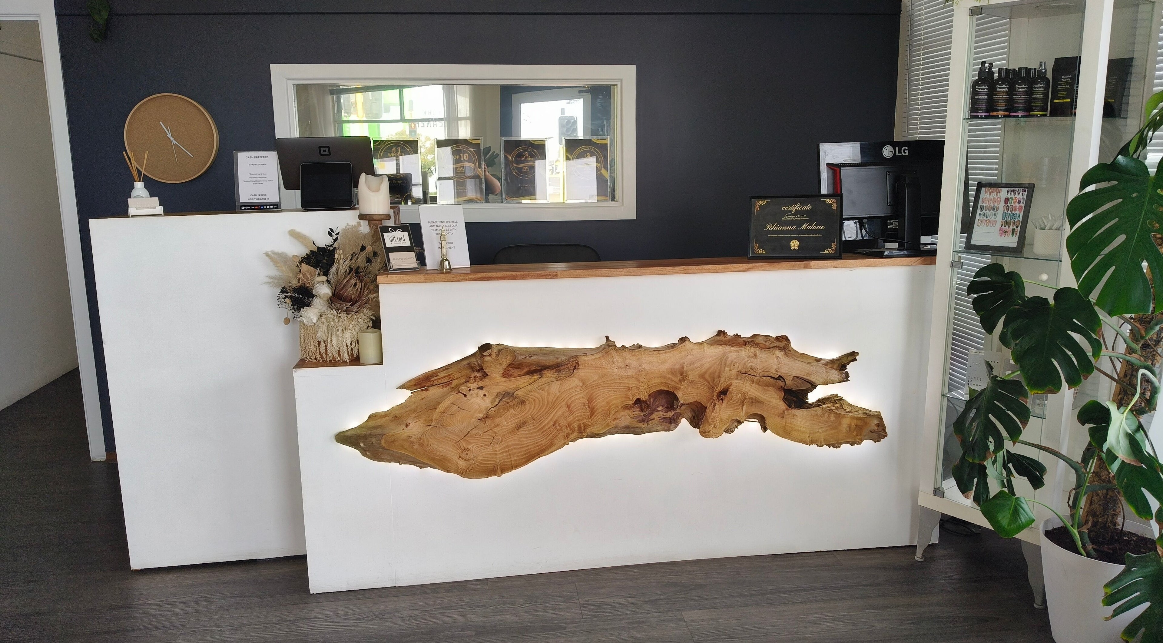 Reception area of Allure Beauty & Co, Bunbury, Western Australia, AU featuring a rustic wood design.