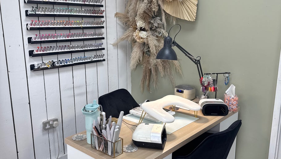 Cozy nail station at Nails by Lia in Wednesbury, England with elegant decor and nail polish display.
