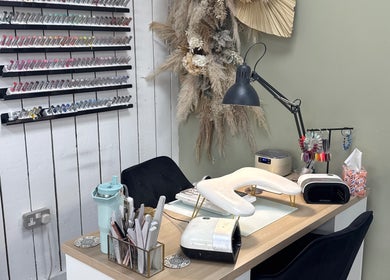 Cozy nail station at Nails by Lia in Wednesbury, England with elegant decor and nail polish display.
