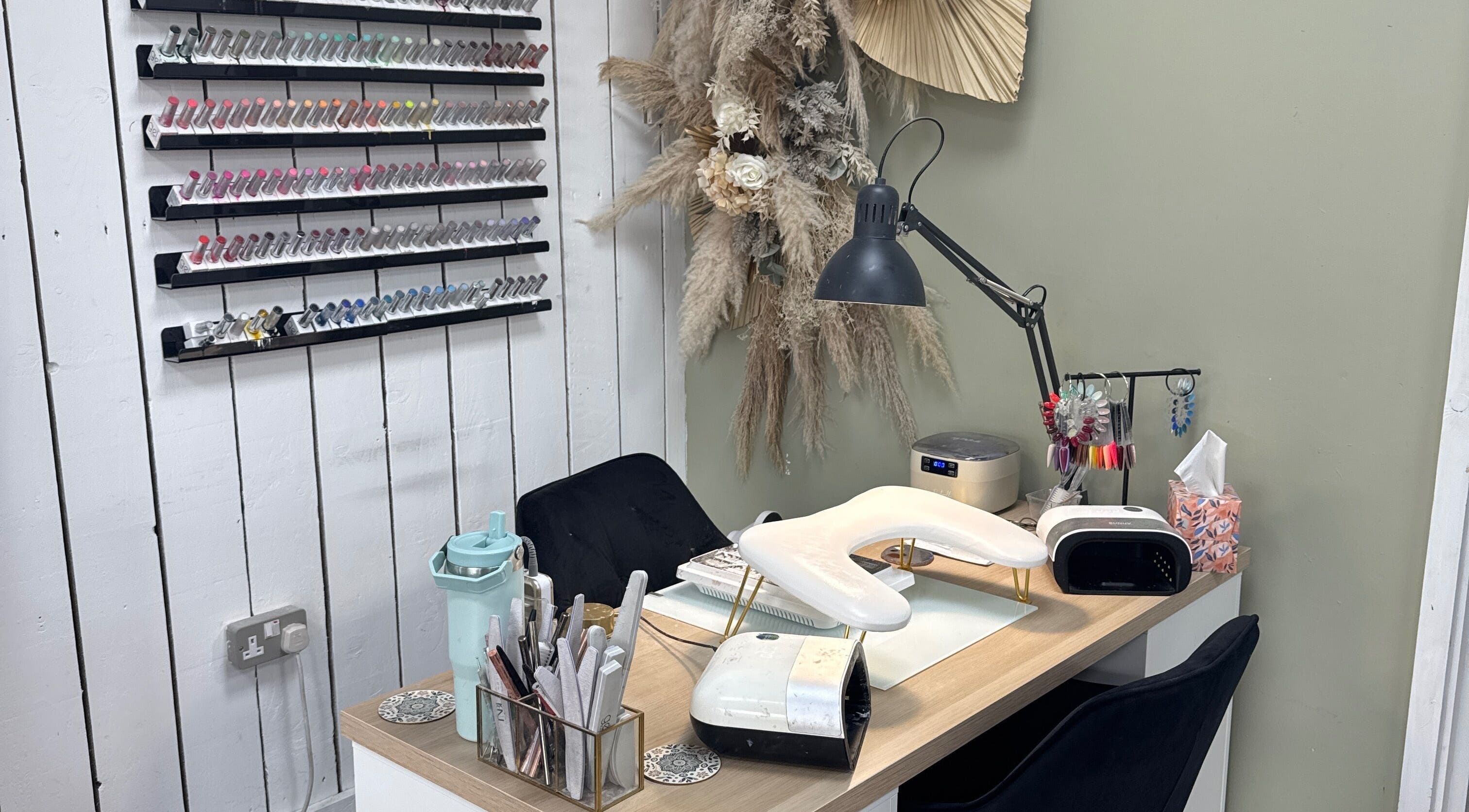 Cozy nail station at Nails by Lia in Wednesbury, England with elegant decor and nail polish display.