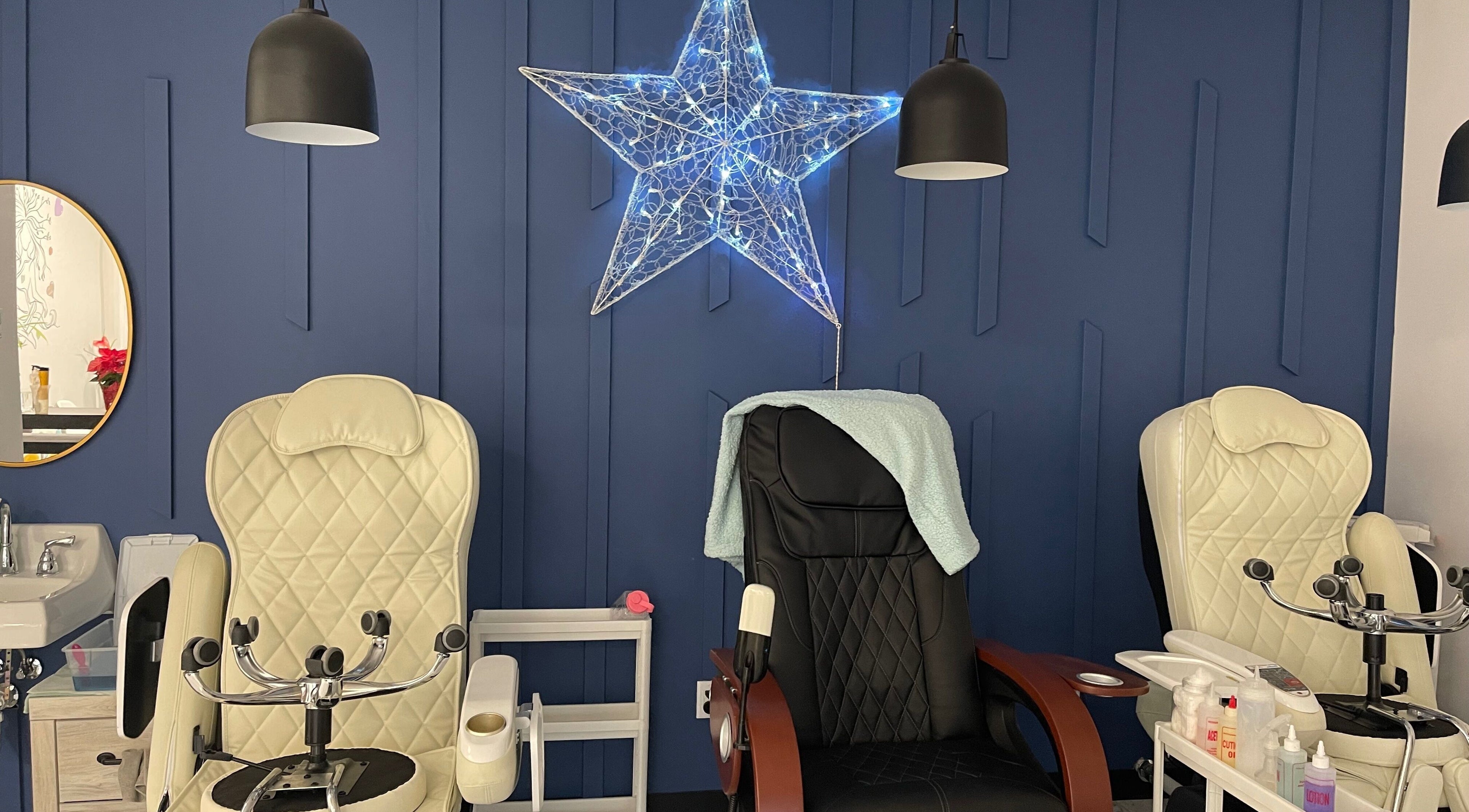 Elegant pedicure chairs with a star decoration at Monserrat Nails, Kenosha, Wisconsin, US.
