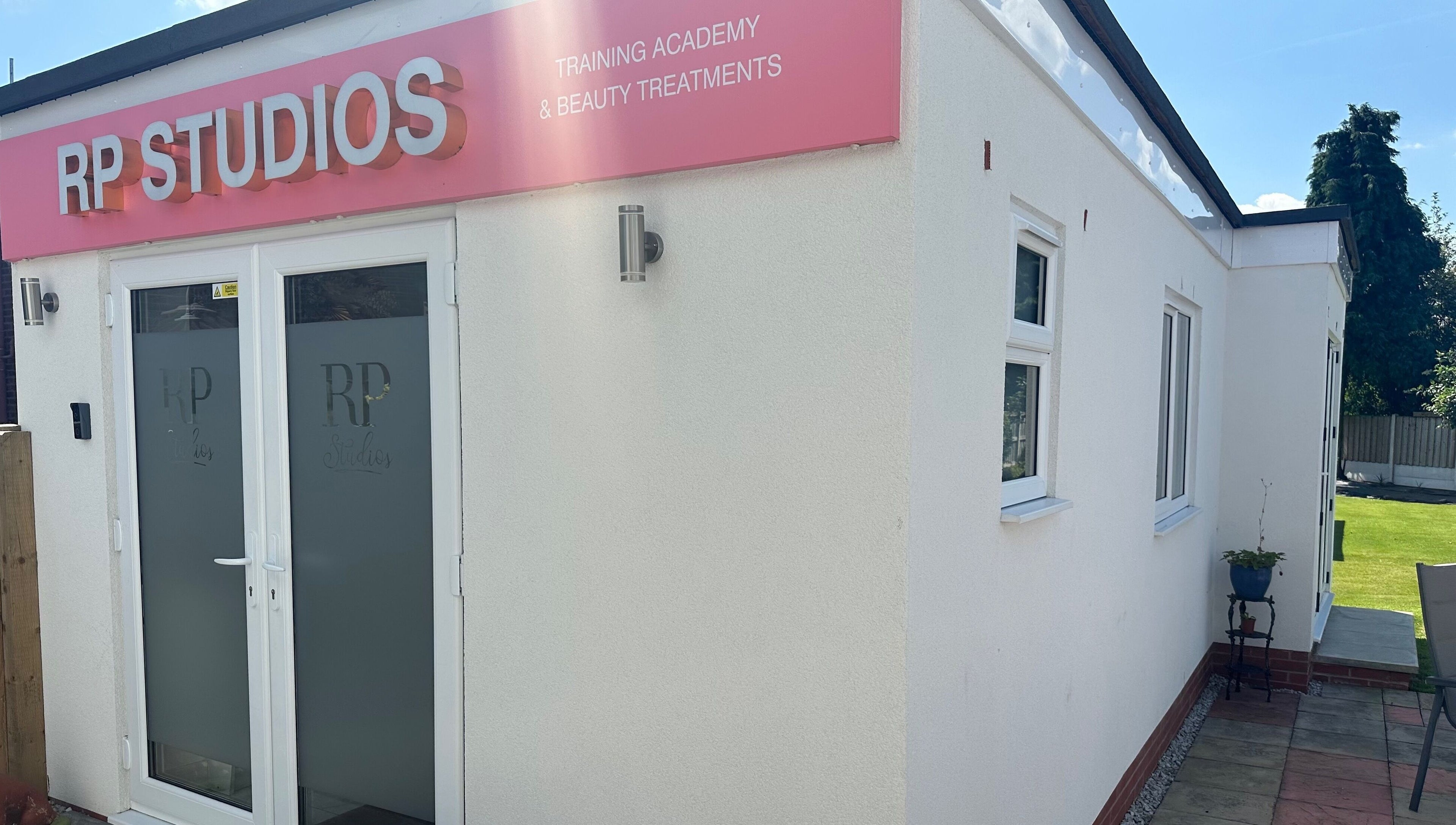 Front view of RP Studios, beauty training academy in Milnrow, England, GB, showcasing modern design.