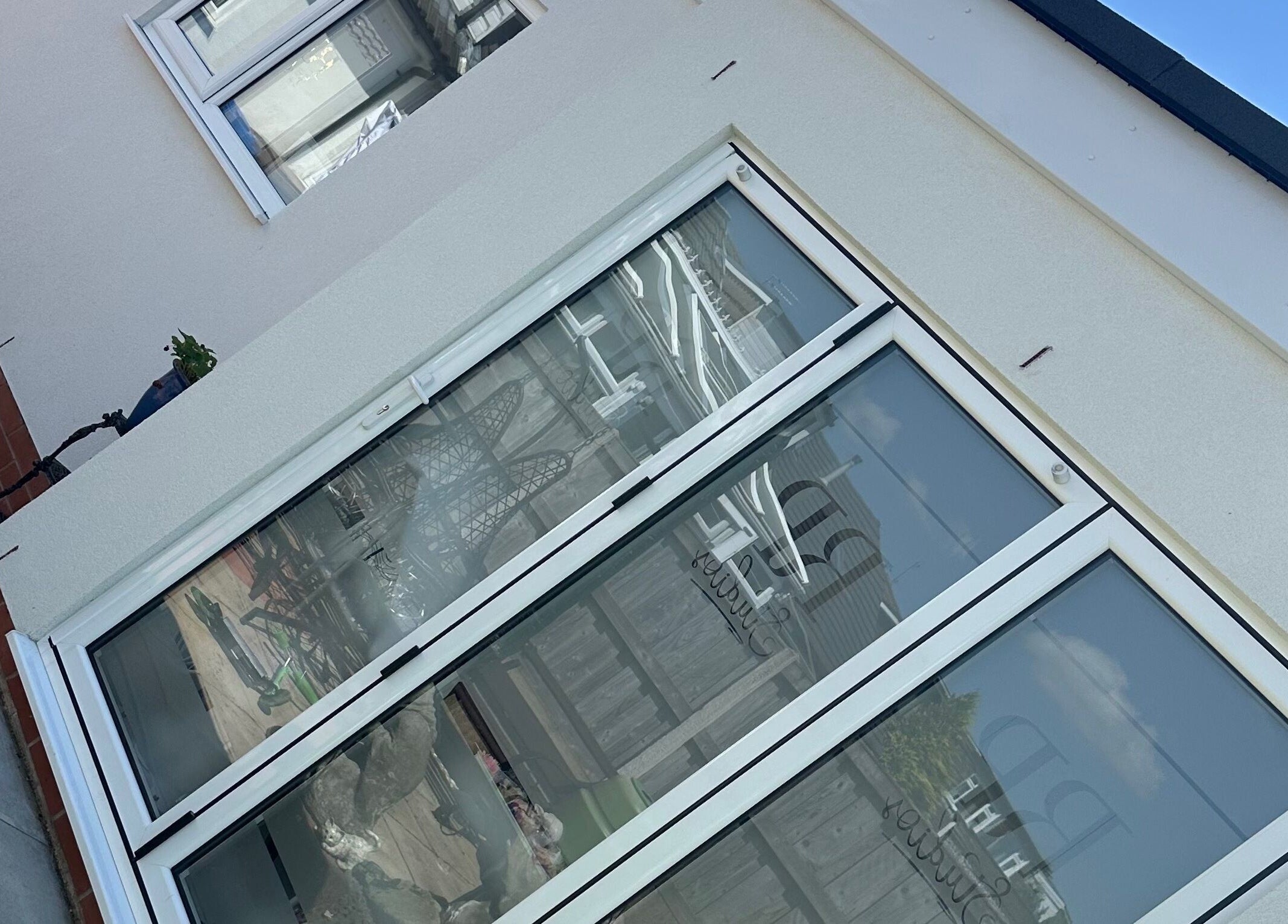 Entrance of RP Studios in Milnrow, England, GB with glass doors and modern design.