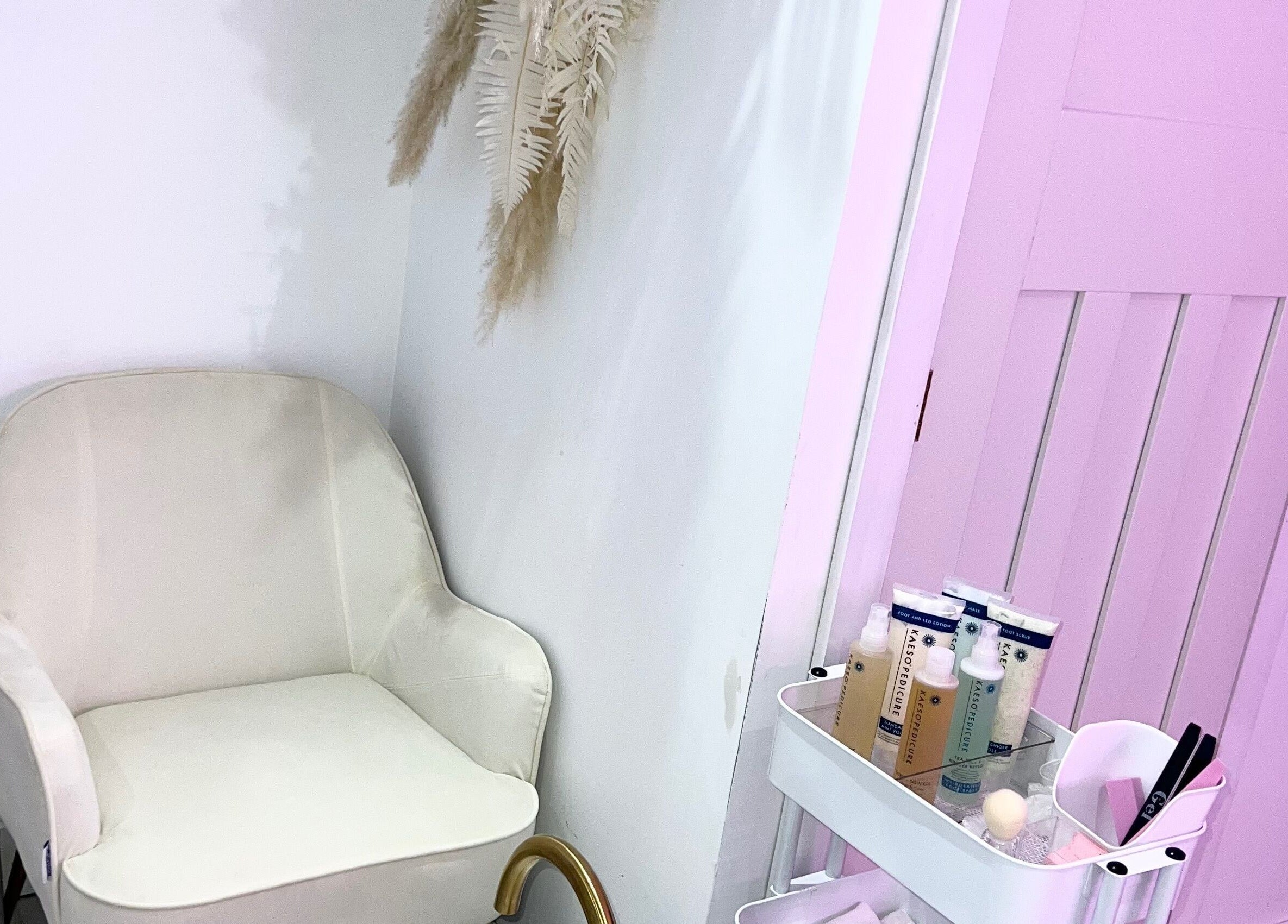A relaxing treatment area in RP Studios, Milnrow, England, GB with a comfy chair and beauty products.