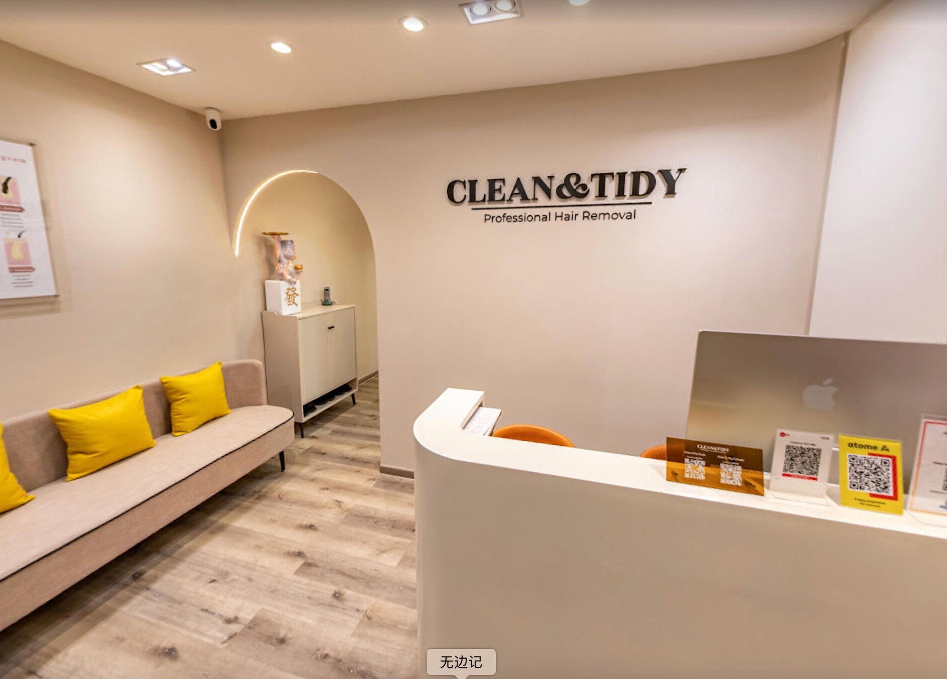 Reception area at Clean and Tidy Orchard in Singapore featuring modern decor and cozy seating.