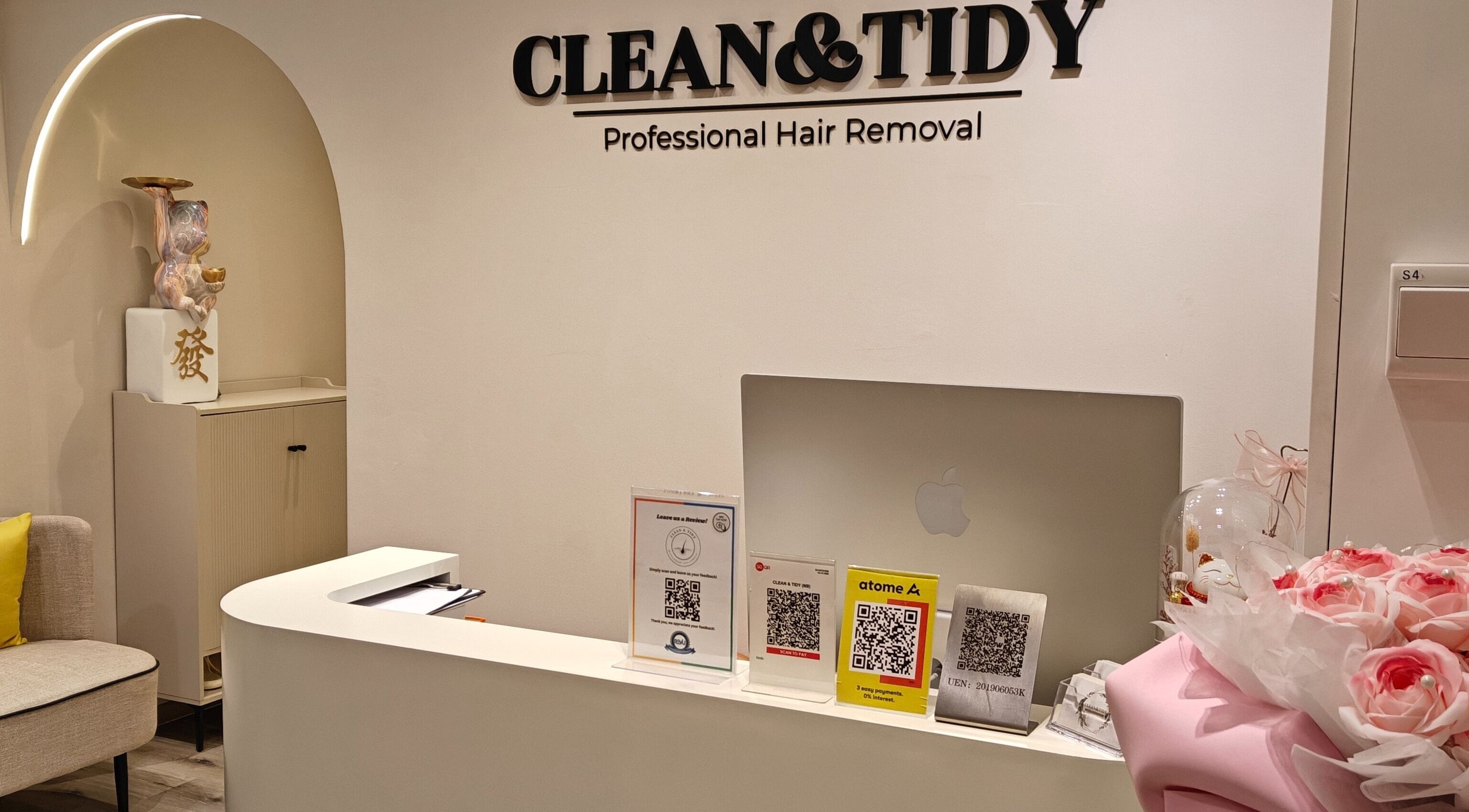 Reception at Clean and Tidy Orchard, Singapore, SG with floral decor and QR codes.