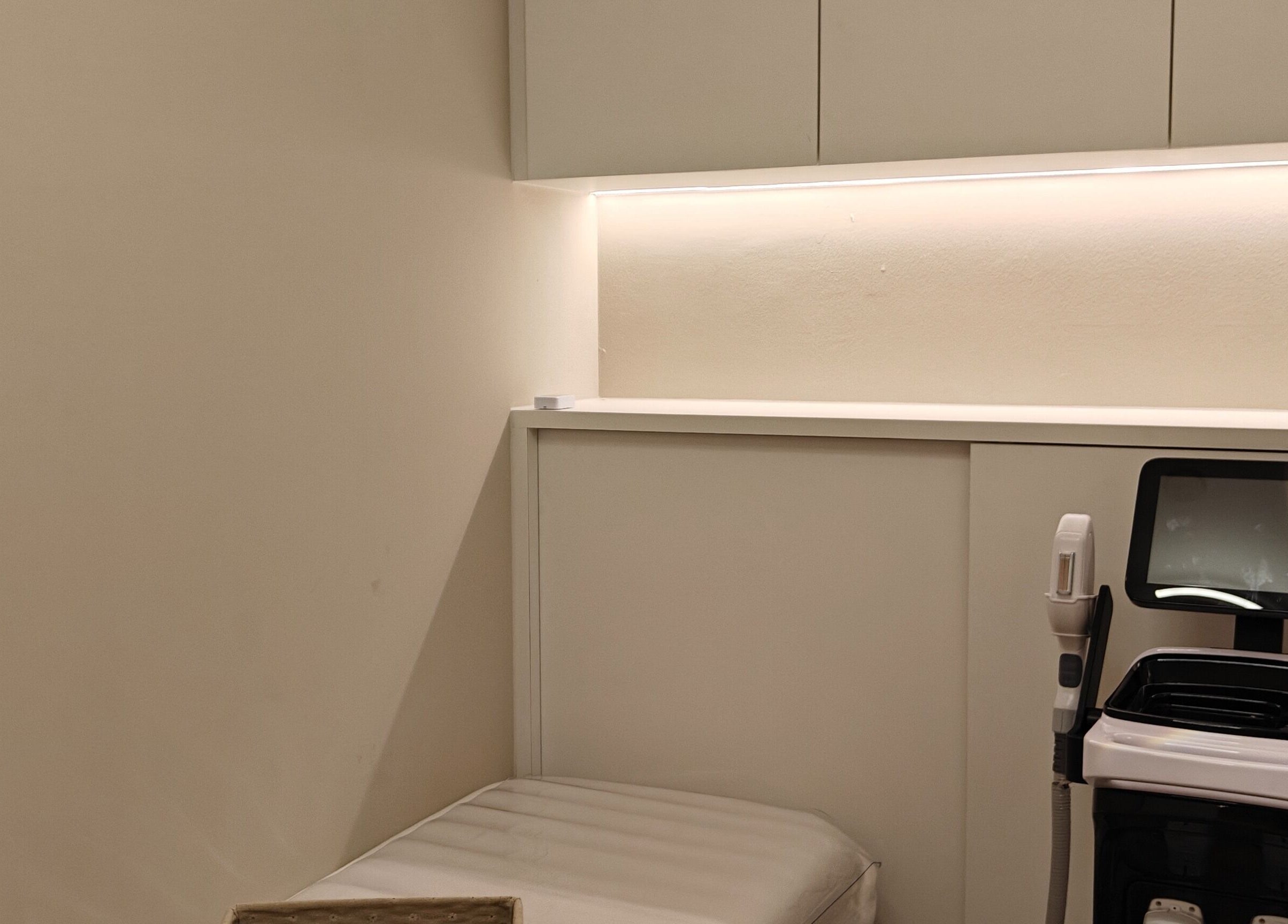 Clean and Tidy Orchard in Singapore offers a serene treatment room with modern equipment for wellness services.