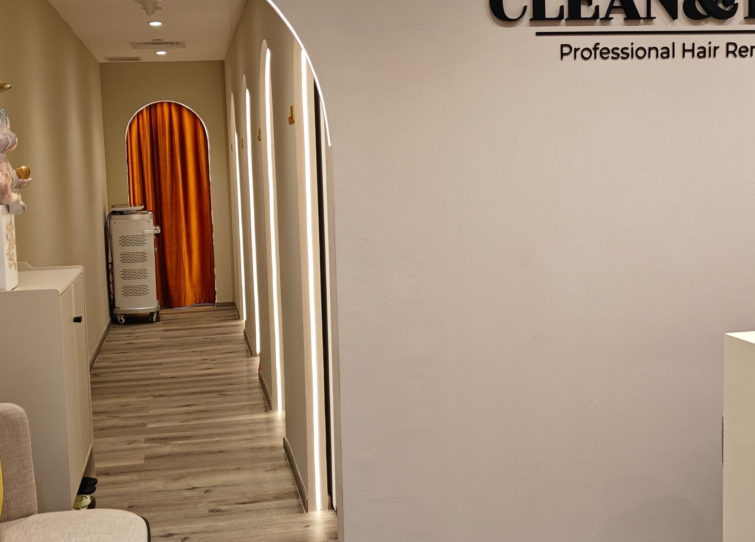 Sleek hallway at Clean and Tidy Orchard in Singapore, SG, with modern decor and ambient lighting.