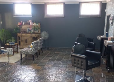 Chic vintage salon interior at New Millennium Hair Studio, Lydenburg, Mpumalanga, ZA featuring stylish furniture.