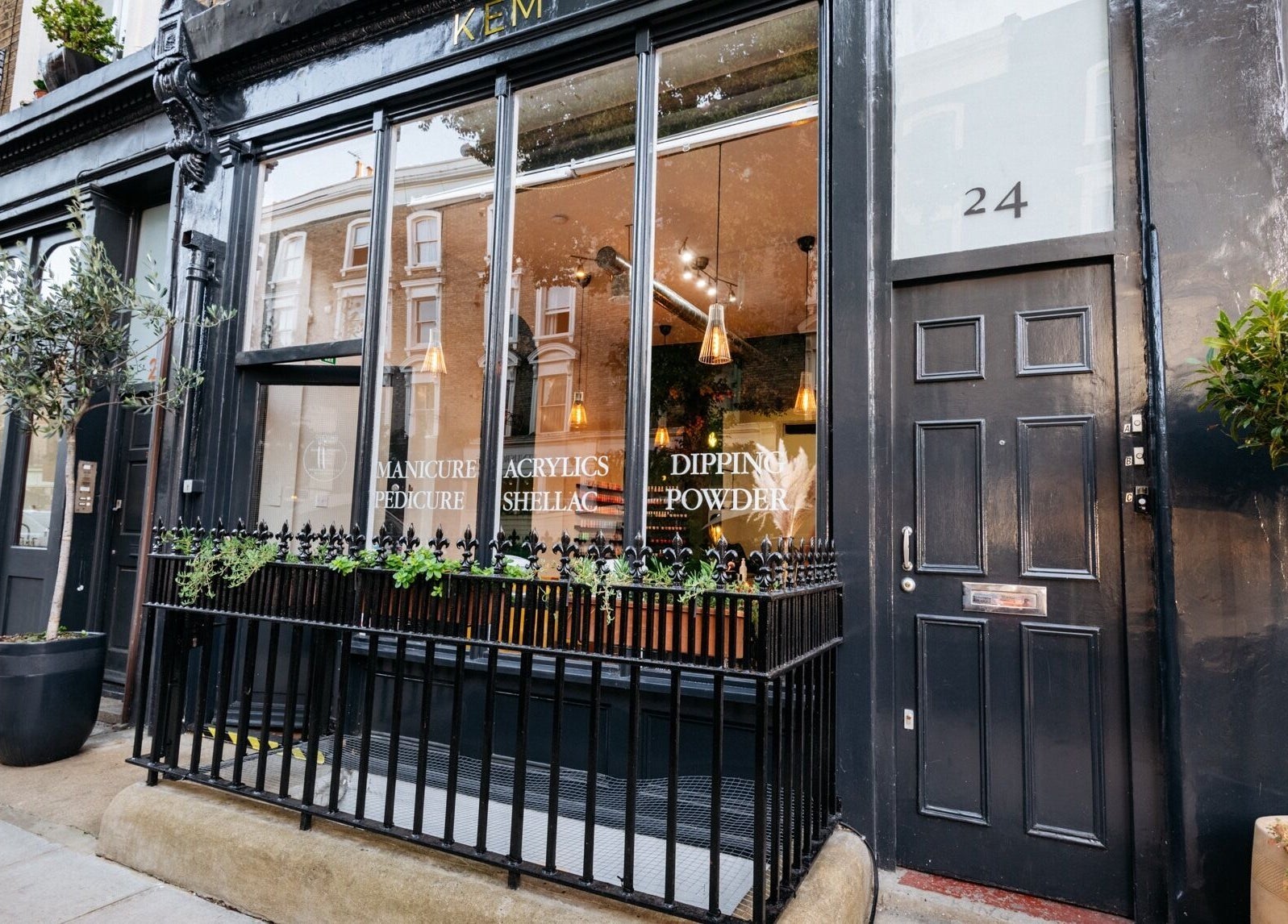 Exterior view of Kem Nail Bar located in London, England, GB showcasing its stylish storefront.