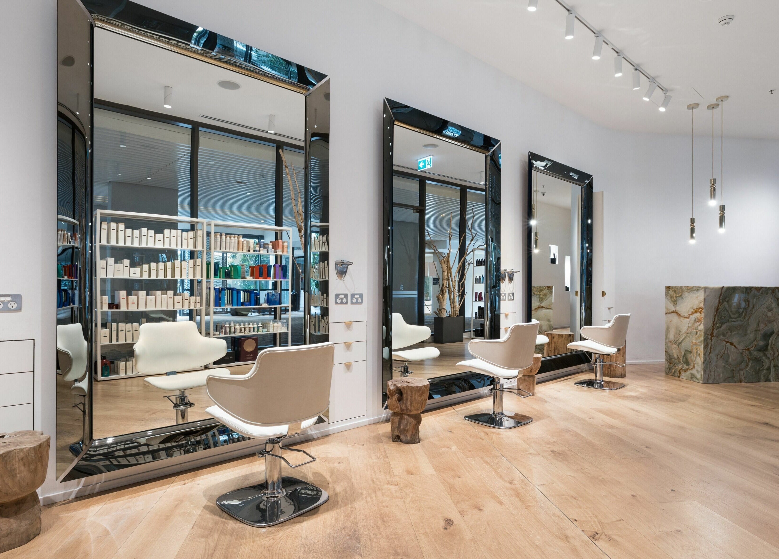 Modern salon interior at Koda Cutters - Bondi, Bondi Beach, New South Wales, AU, with stylish mirrors and seating.