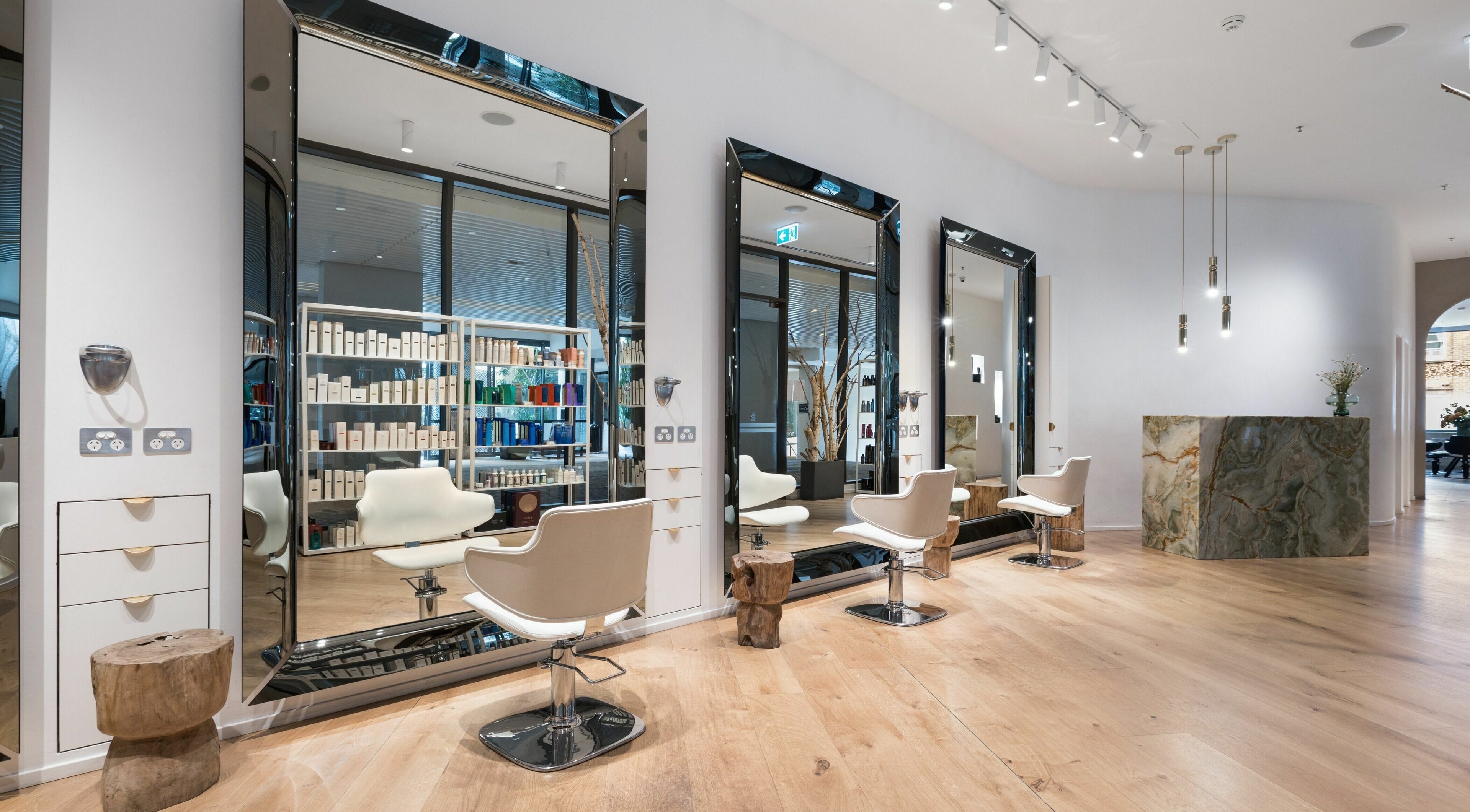 Modern salon interior at Koda Cutters - Bondi, Bondi Beach, New South Wales, AU, with stylish mirrors and seating.