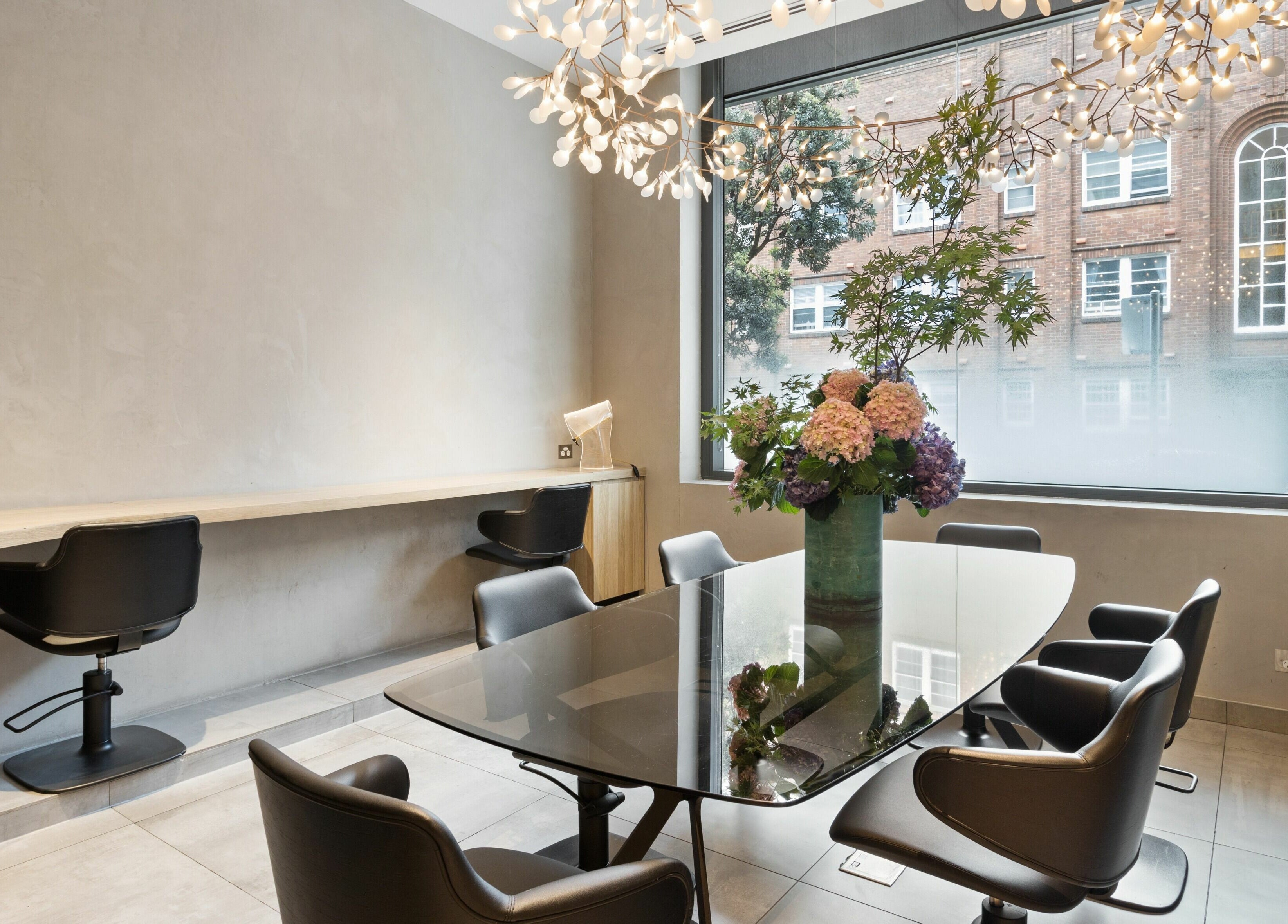 Modern salon with chic decor at Koda Cutters - Bondi, Bondi Beach, New South Wales, AU featuring stylish seating.