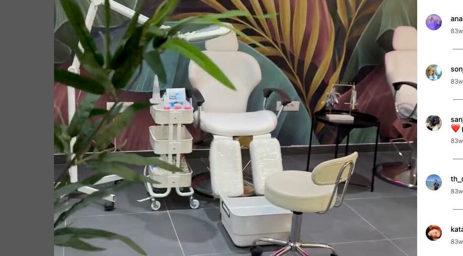 Pedicure station at Studio Banja, Београд, RS, with vibrant wall art and comfortable seating.