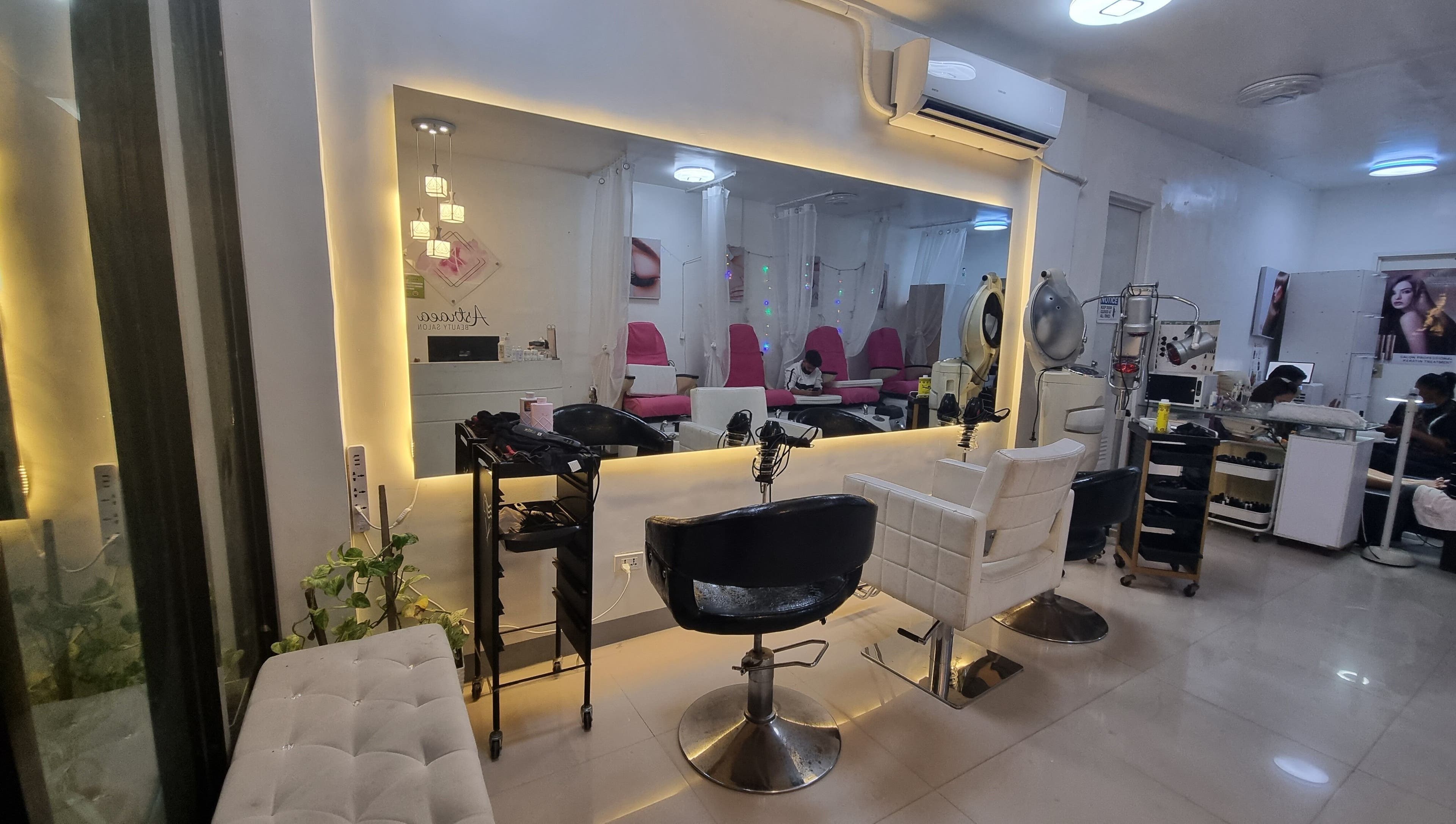 Interior of Astraea Beauty Salon in Las Pinas, Metro Manila, PH showcasing modern and elegant styling chairs.