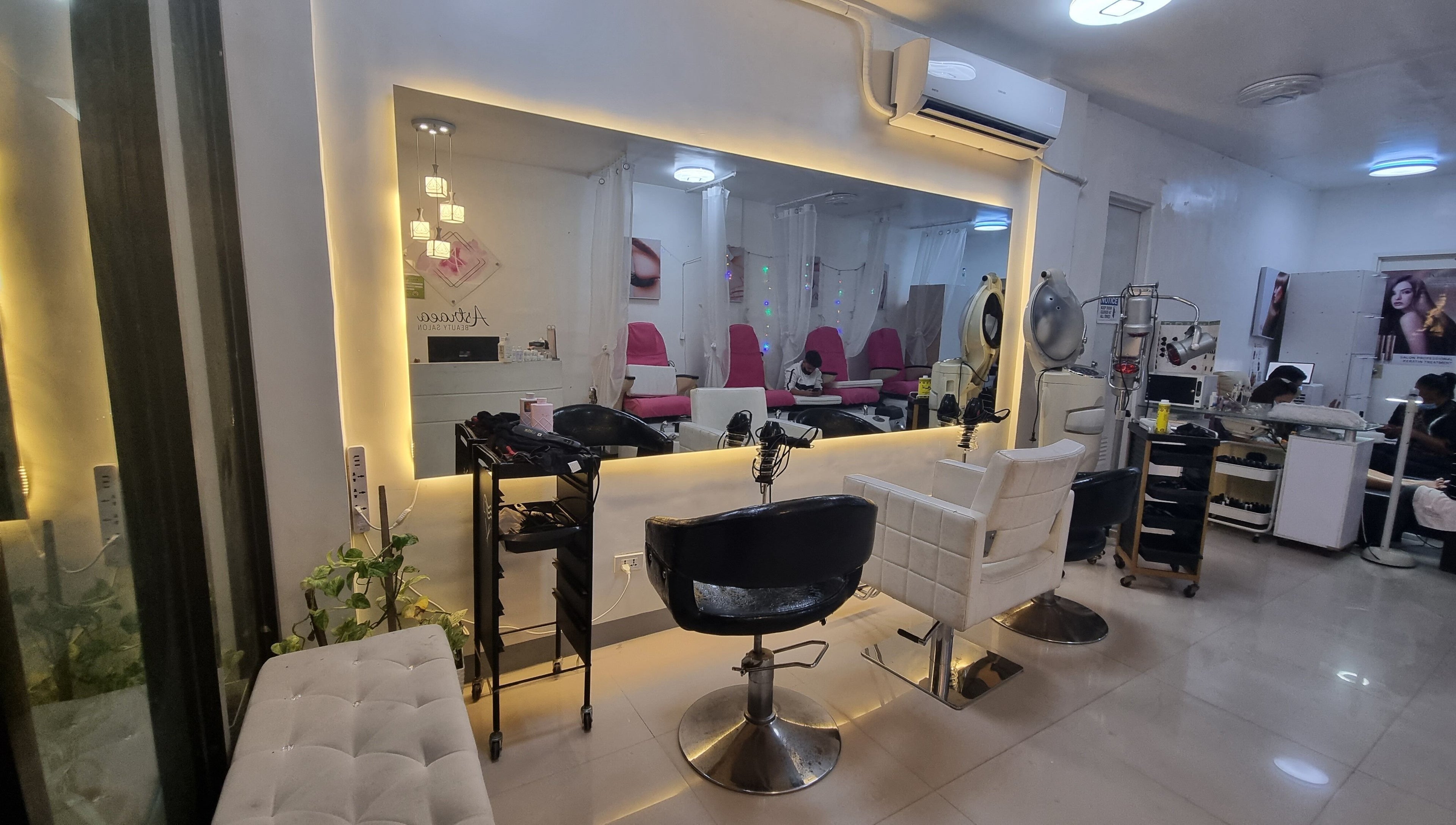 Interior of Astraea Beauty Salon in Las Pinas, Metro Manila, PH showcasing modern and elegant styling chairs.