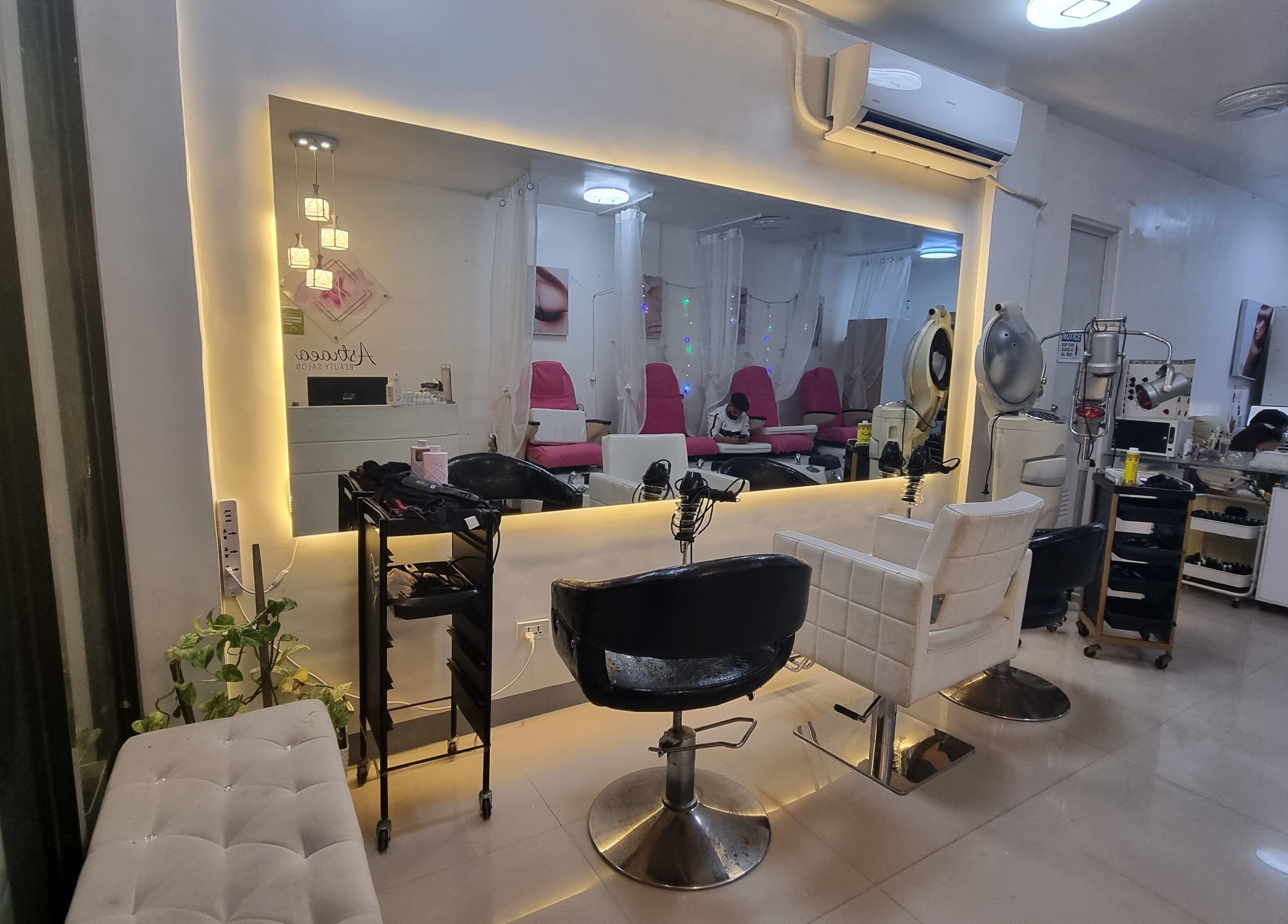 Interior of Astraea Beauty Salon in Las Pinas, Metro Manila, PH showcasing modern and elegant styling chairs.