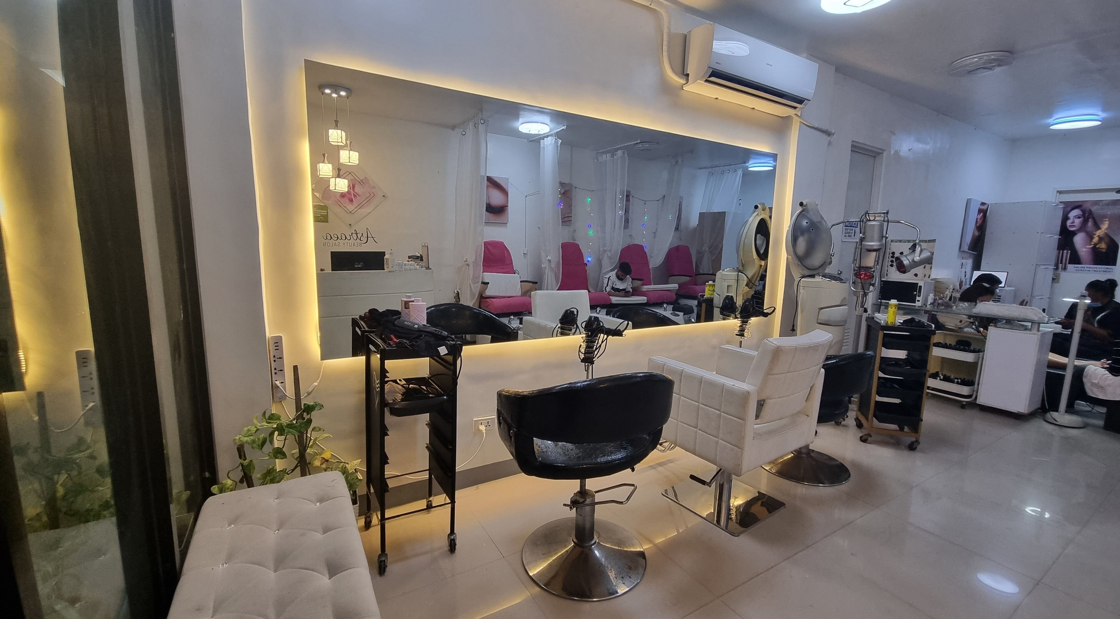 Interior of Astraea Beauty Salon in Las Pinas, Metro Manila, PH showcasing modern and elegant styling chairs.