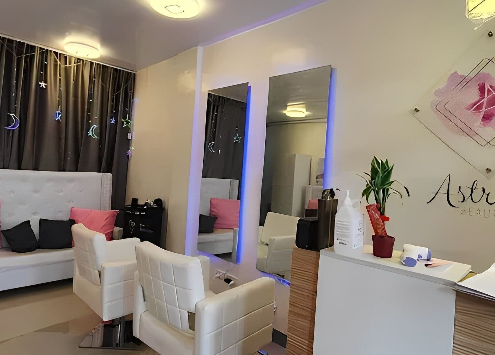 Cozy interior of Astraea Beauty Salon in Las Pinas, Metro Manila, PH, featuring modern chairs and decor.