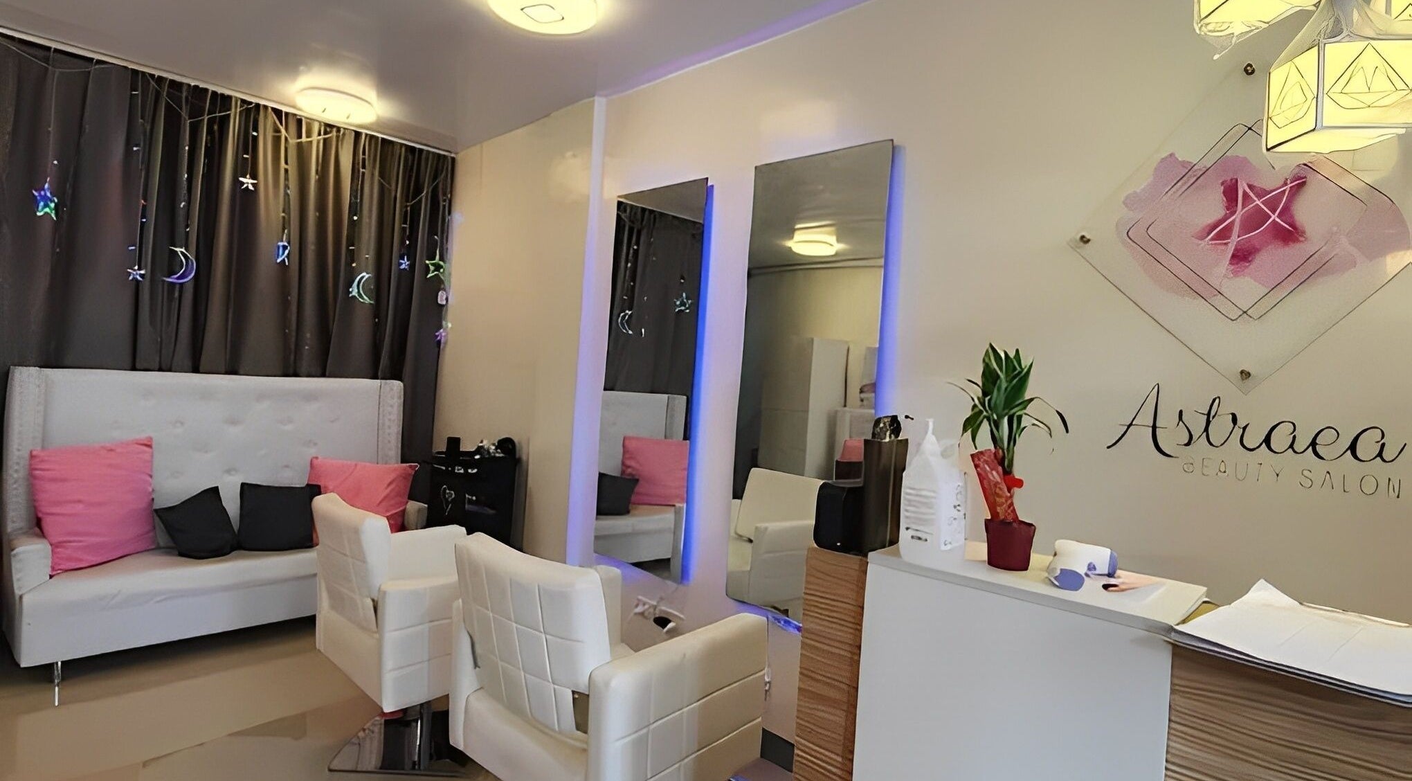 Cozy interior of Astraea Beauty Salon in Las Pinas, Metro Manila, PH, featuring modern chairs and decor.