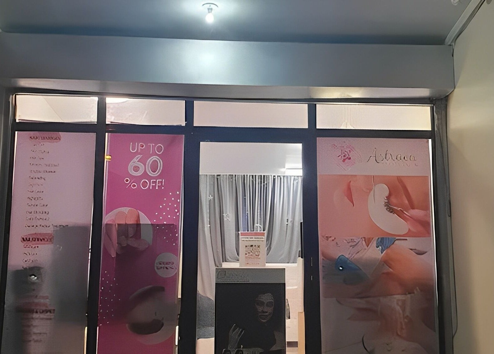 Front view of Astraea Beauty Salon in Las Pinas, Metro Manila, PH, featuring promotional posters.