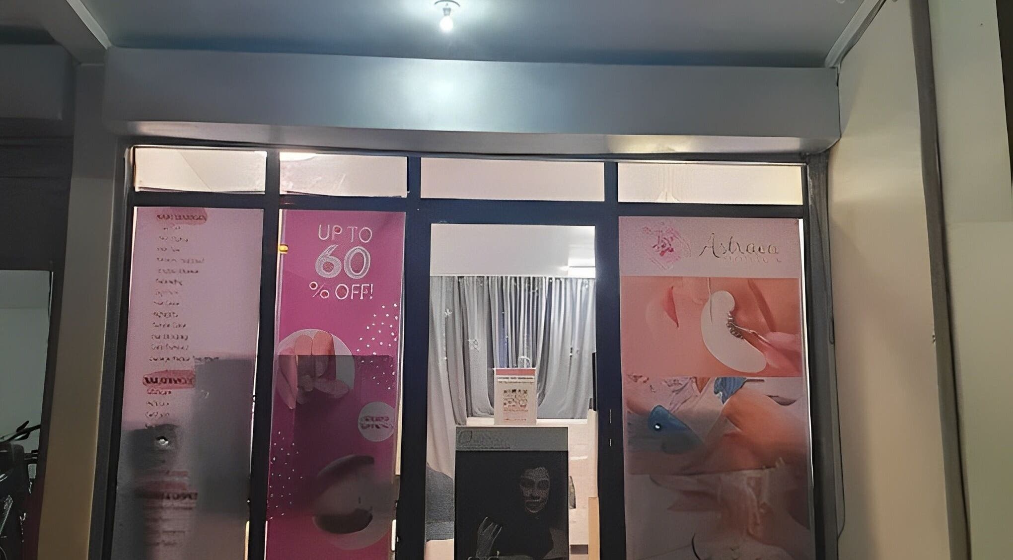 Front view of Astraea Beauty Salon in Las Pinas, Metro Manila, PH, featuring promotional posters.