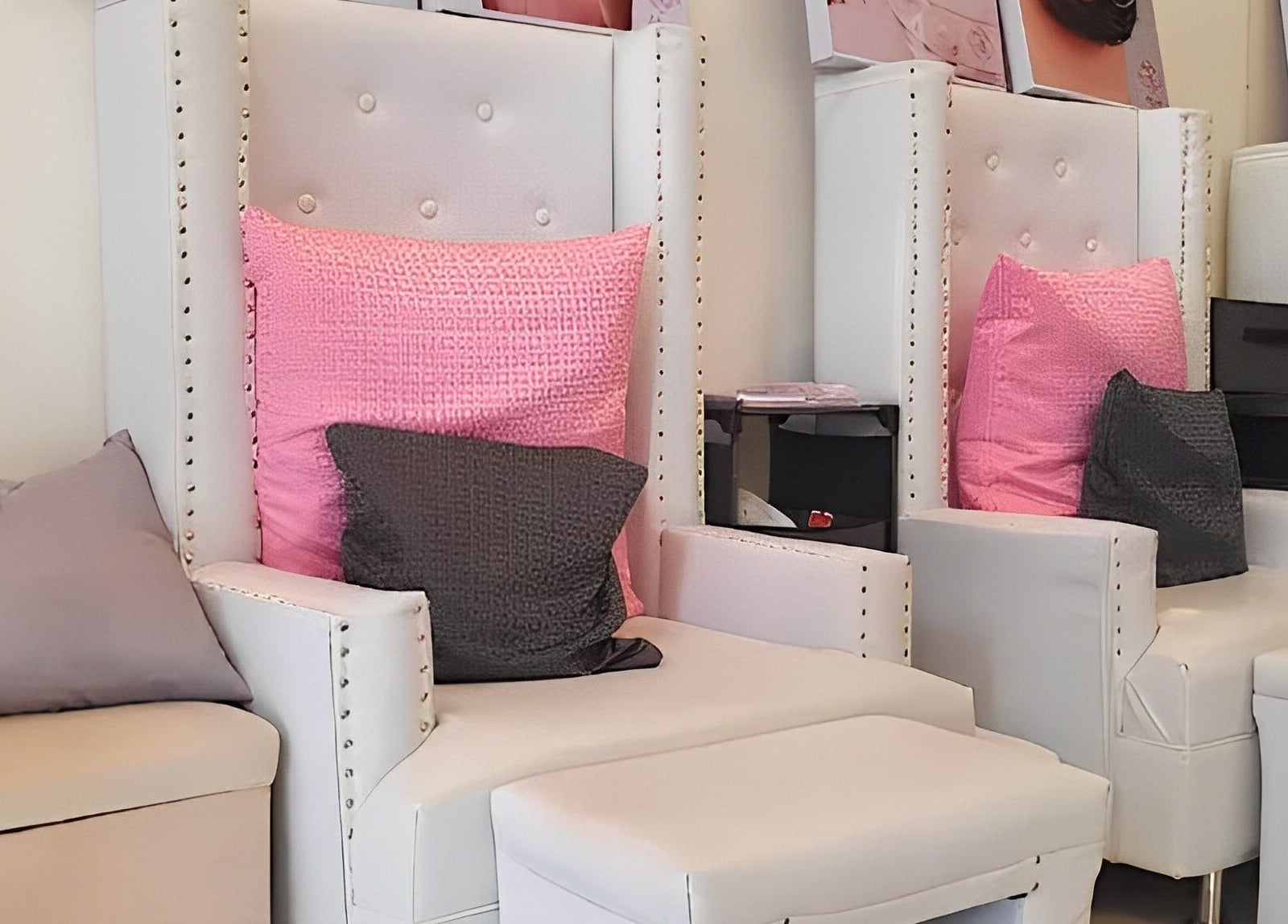 Luxurious seating at Astraea Beauty Salon, Las Pinas, Metro Manila, PH with elegant white chairs and pink cushions.